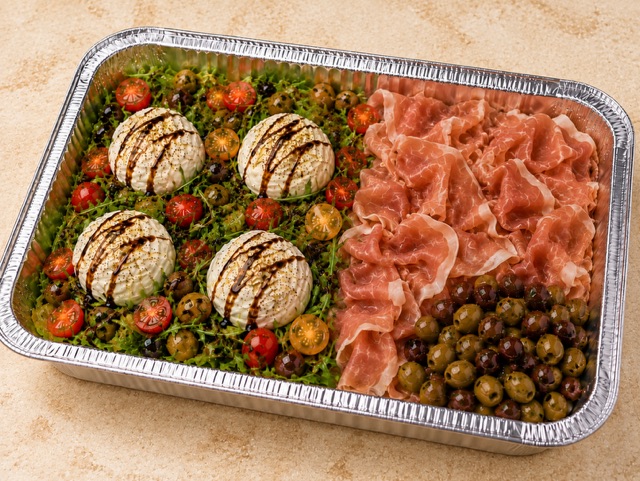 Burrata & Prosciutto served in a party tray