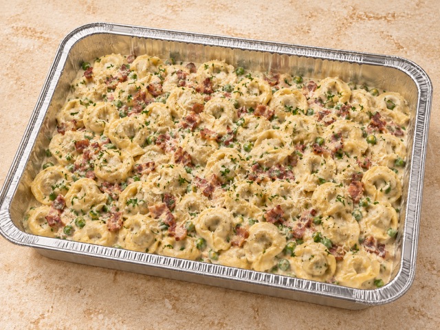 Tortellini Capricciosi served in a party tray