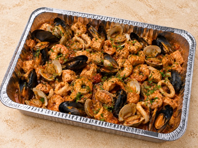 Cioppino served in a party tray